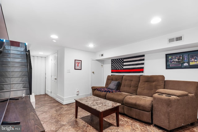 living area with recessed lighting, visible vents, baseboards, and stairs