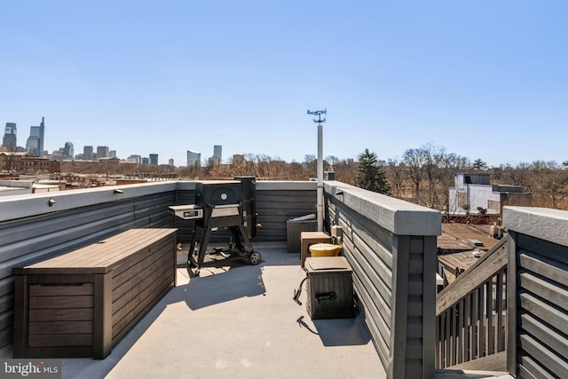 view of patio / terrace featuring a city view