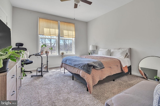 carpeted bedroom with baseboards and ceiling fan
