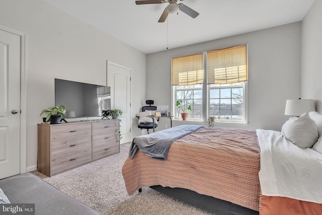 carpeted bedroom featuring a ceiling fan
