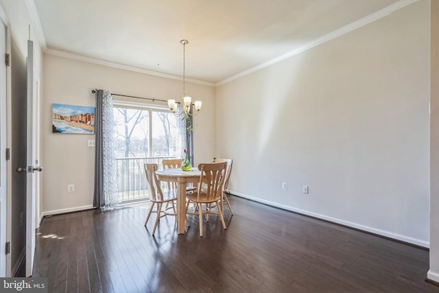 dining room with ornamental molding, a notable chandelier, baseboards, and dark wood finished floors