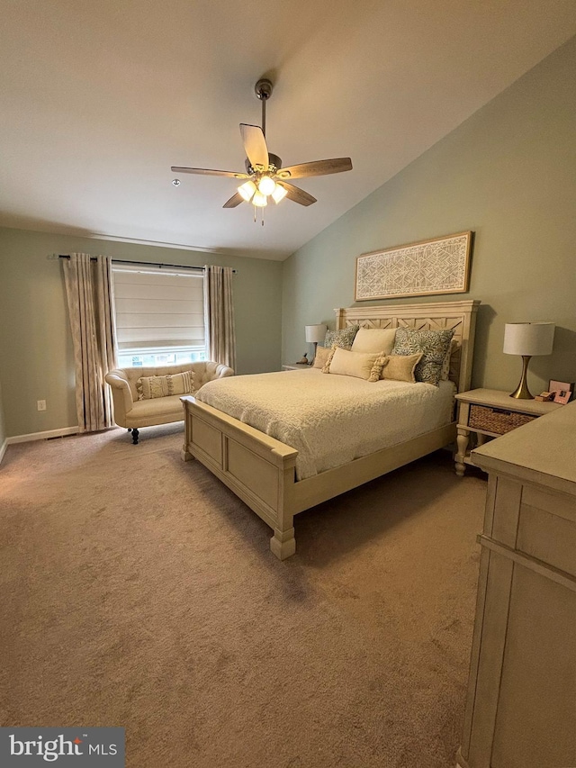 bedroom with a ceiling fan, lofted ceiling, and carpet