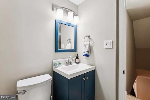 half bath with toilet and vanity