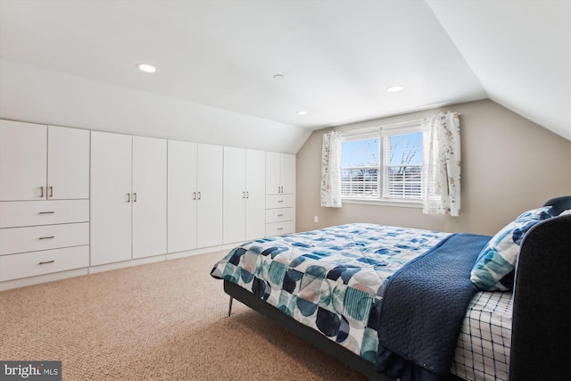 bedroom featuring vaulted ceiling, recessed lighting, and carpet floors