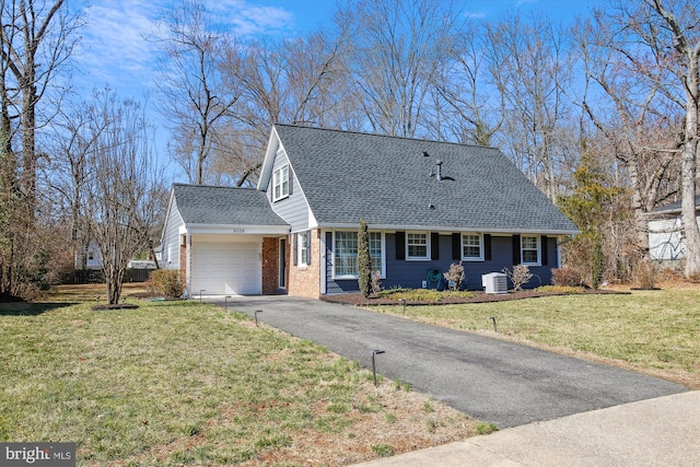 cape cod house featuring a front yard, roof with shingles, an attached garage, aphalt driveway, and brick siding