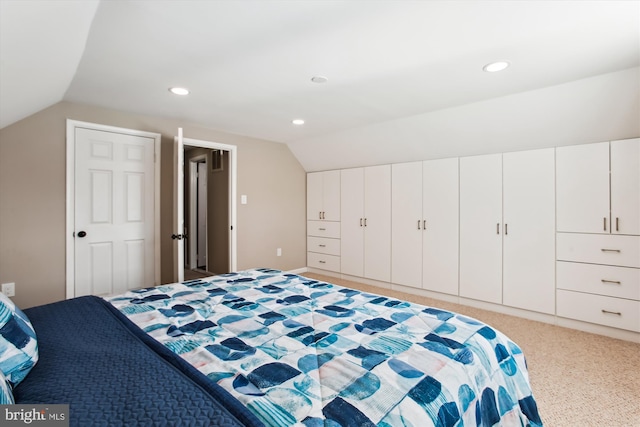 bedroom featuring lofted ceiling, recessed lighting, and light carpet