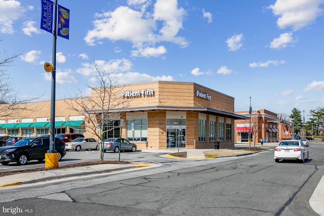 view of property featuring uncovered parking