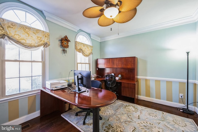 office area with wallpapered walls, baseboards, ornamental molding, wood finished floors, and a ceiling fan