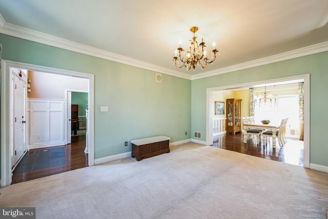 unfurnished dining area featuring baseboards, carpet, an inviting chandelier, and ornamental molding