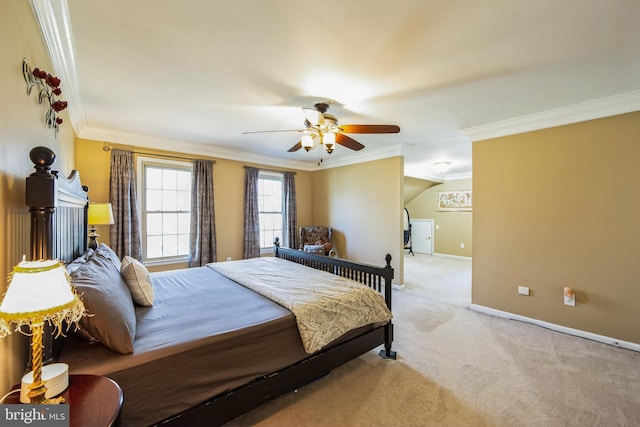 carpeted bedroom featuring a ceiling fan, baseboards, and ornamental molding