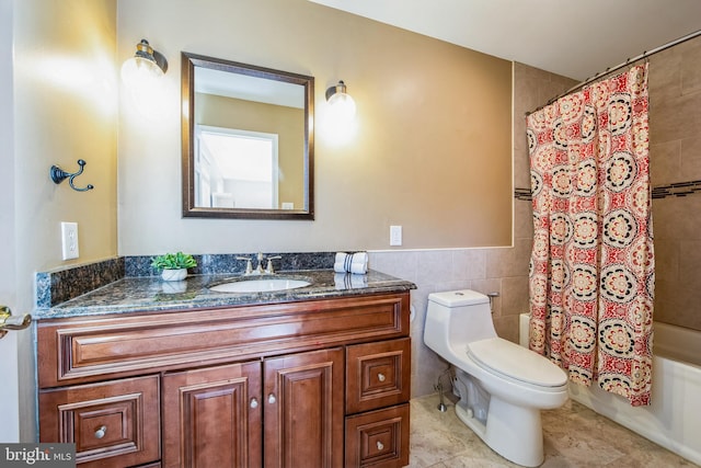 full bath featuring vanity, tile patterned flooring, tile walls, toilet, and shower / tub combo with curtain