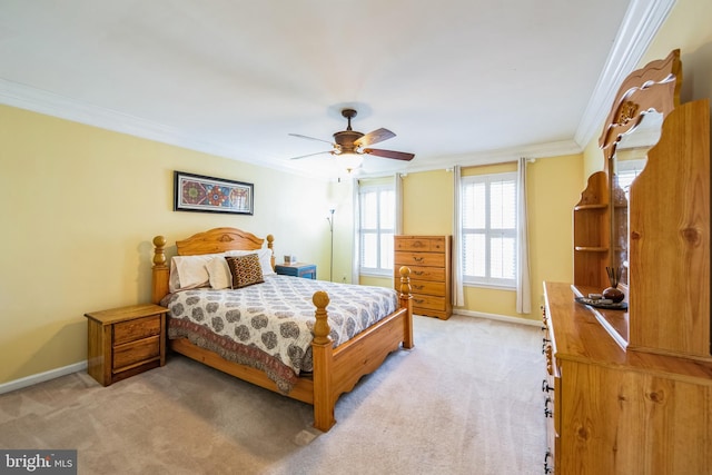 bedroom with light carpet, ceiling fan, baseboards, and ornamental molding