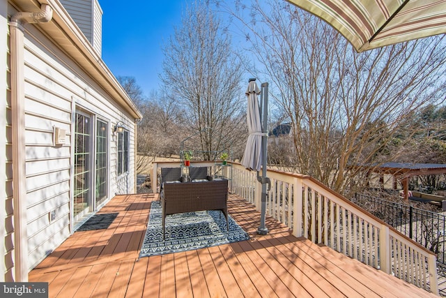 wooden terrace featuring outdoor lounge area