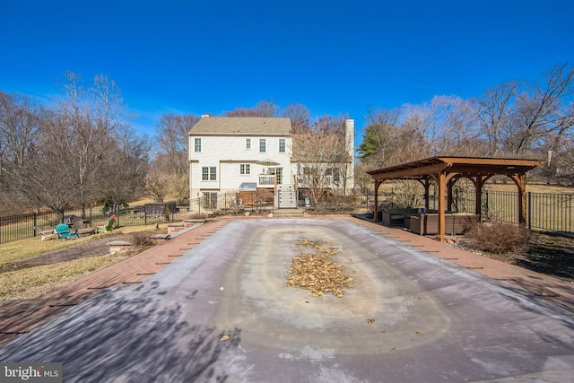 exterior space with a gazebo and fence