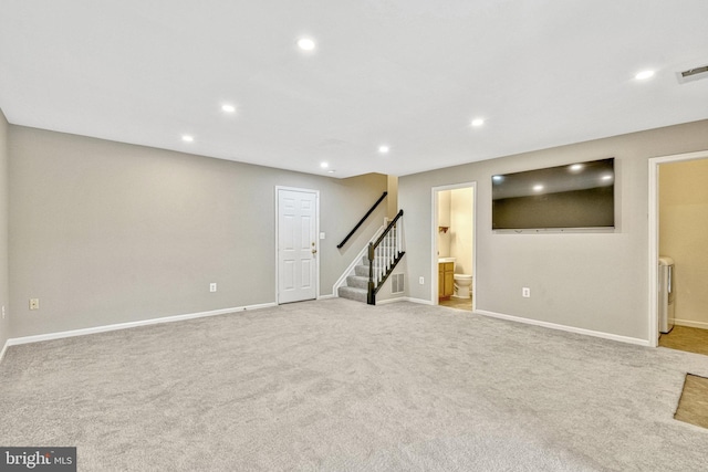 basement featuring stairway, carpet, visible vents, baseboards, and recessed lighting