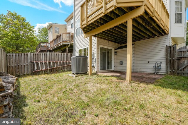 view of yard with a patio, central AC unit, and a fenced backyard