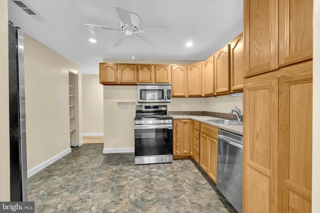 9920 Walker House Rd Unit 5, Gaithersburg, MD 20886 - kitchen featuring stainless steel appliances, a sink, a ceiling fan, baseboards, and light countertops