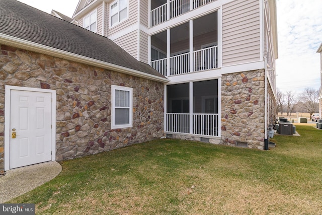 4101D Fullerton Ct, Milford, DE 19963 - exterior space featuring a shingled roof, central AC, a yard, crawl space, and stone siding