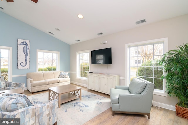 4101D Fullerton Ct, Milford, DE 19963 - living room featuring visible vents, light wood-style floors, and lofted ceiling