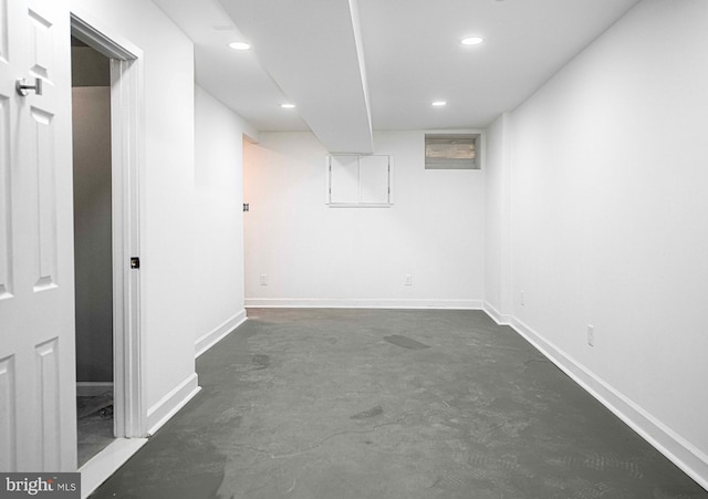 finished basement featuring recessed lighting and baseboards