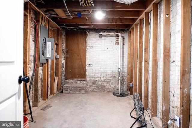 unfinished basement featuring electric panel