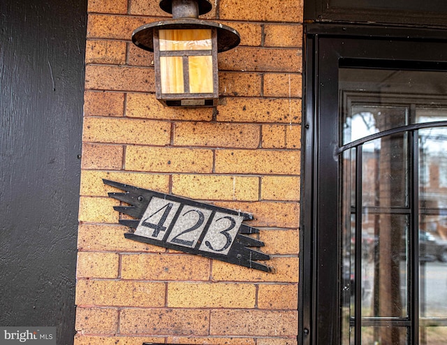 exterior details featuring brick siding