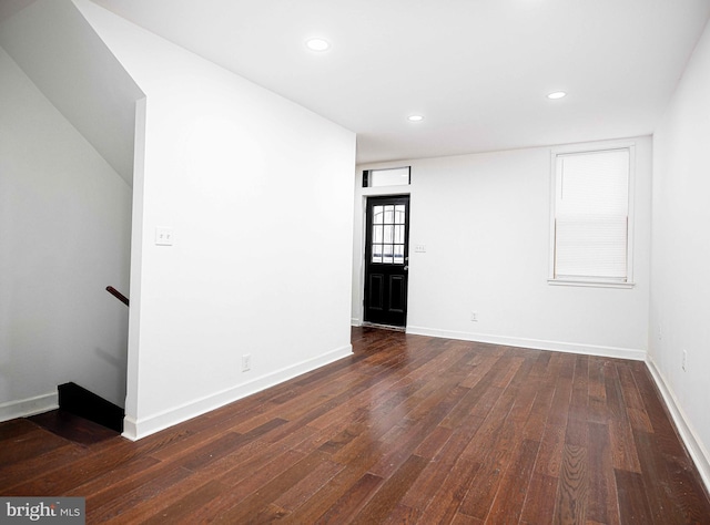 spare room featuring recessed lighting, baseboards, and hardwood / wood-style floors