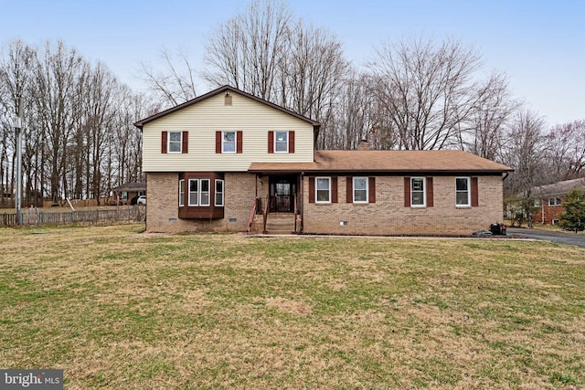 view of front of property with brick siding, a chimney, a front lawn, and fence