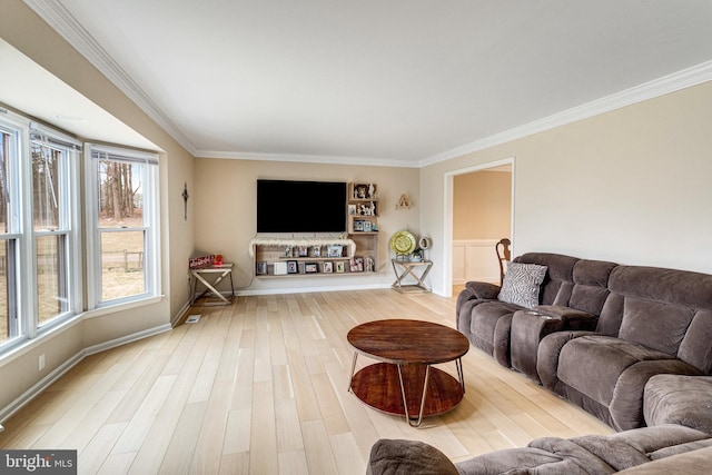 living room with baseboards, wood finished floors, and ornamental molding