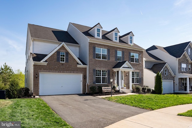view of front facade featuring brick siding, driveway, central AC, a front yard, and an attached garage