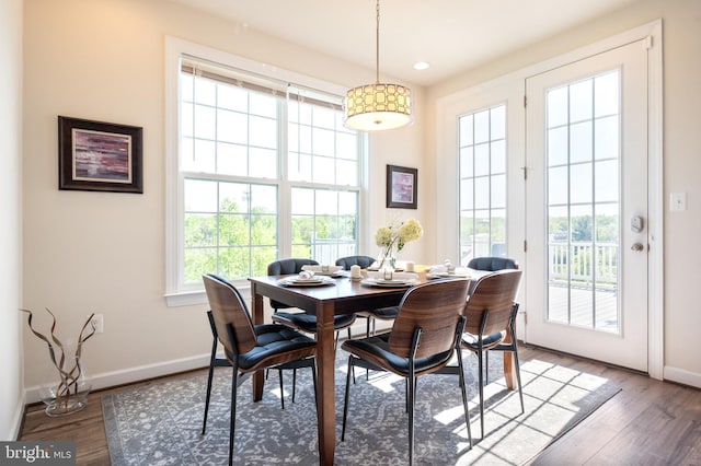 dining space featuring baseboards, recessed lighting, and wood finished floors