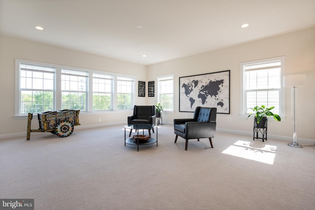 sitting room featuring recessed lighting, carpet flooring, and baseboards