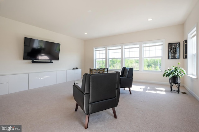 living area featuring carpet, recessed lighting, and baseboards