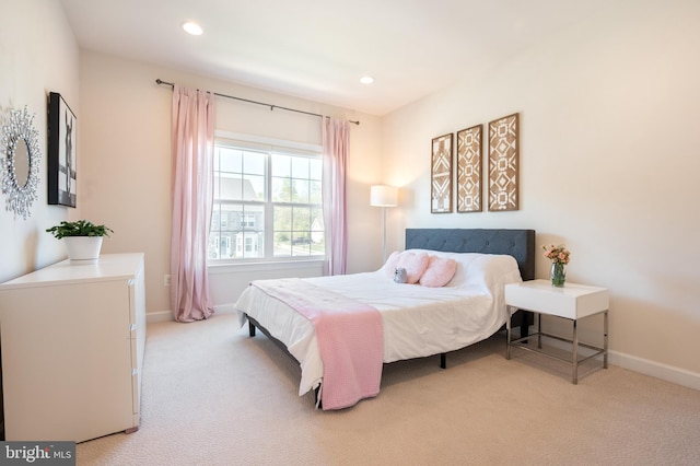 bedroom featuring baseboards, recessed lighting, and light carpet