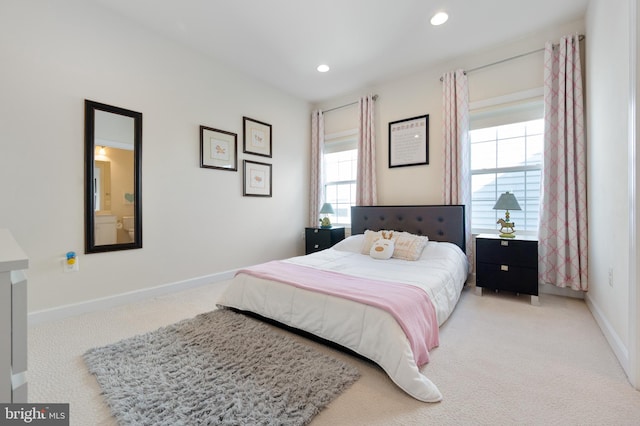 bedroom with recessed lighting, light colored carpet, and baseboards