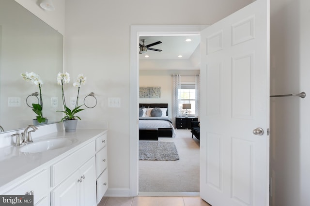 bathroom featuring connected bathroom, ceiling fan, baseboards, tile patterned floors, and vanity