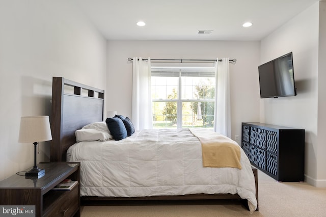 carpeted bedroom featuring visible vents and recessed lighting