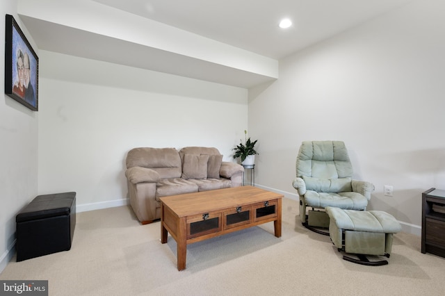 carpeted living area with baseboards and recessed lighting