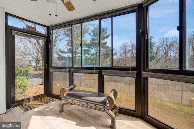 sunroom with a ceiling fan