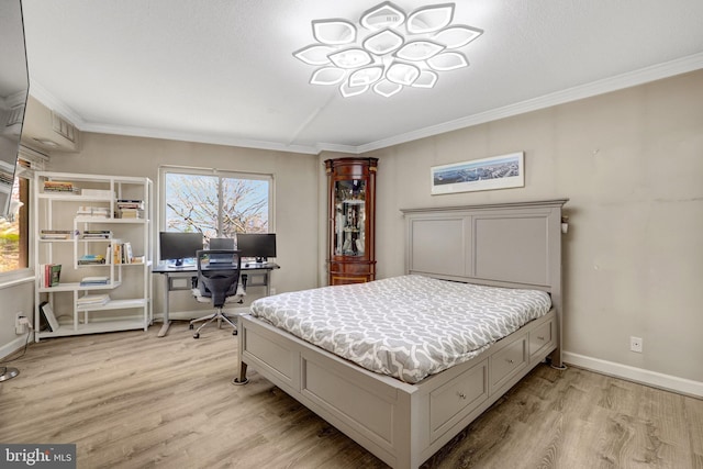 bedroom featuring crown molding, light wood-type flooring, and baseboards