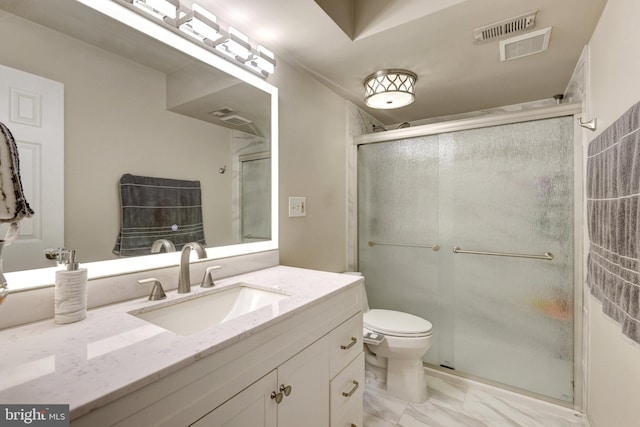 bathroom featuring visible vents, toilet, marble finish floor, a stall shower, and vanity