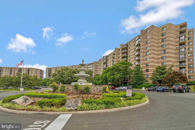 view of property with uncovered parking