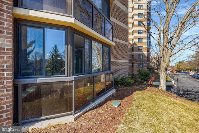 view of side of property with brick siding