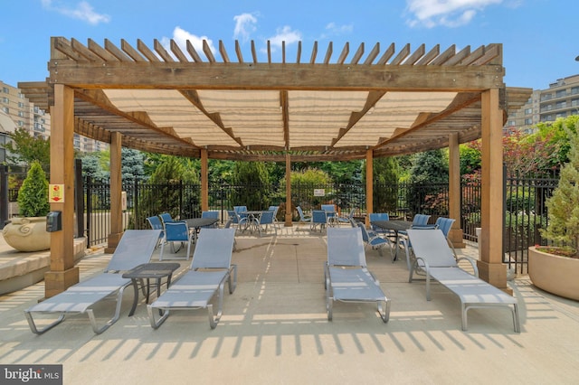 view of patio with fence and a pergola