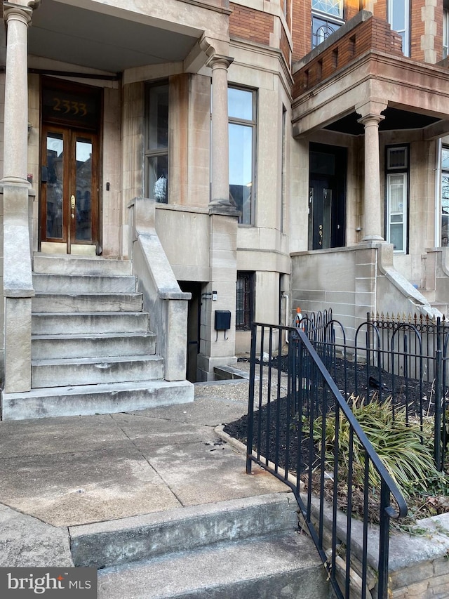 view of exterior entry featuring french doors