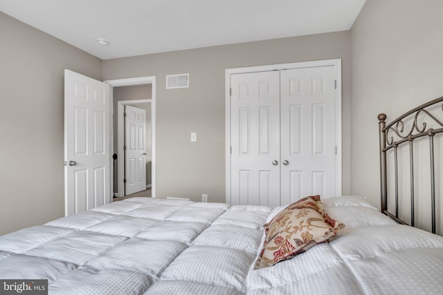 bedroom with visible vents and a closet