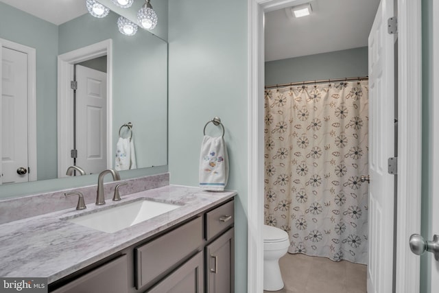 full bath with vanity, tile patterned floors, toilet, and a shower with curtain