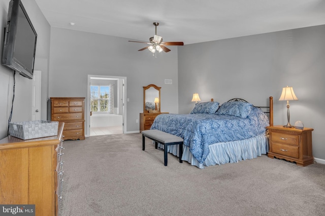 bedroom with baseboards and carpet floors