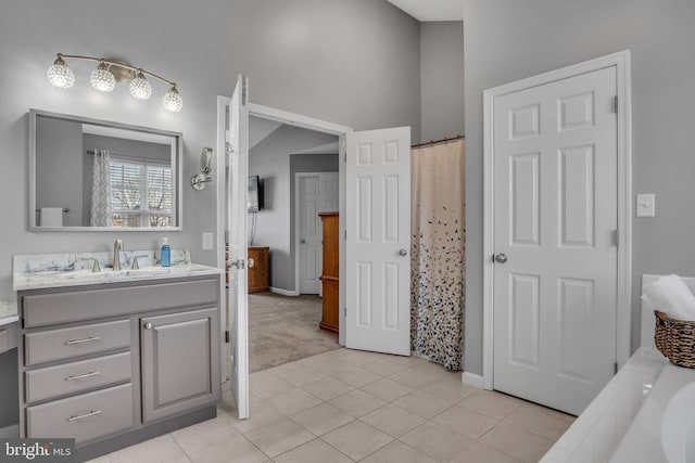 full bathroom featuring vanity, tile patterned floors, and curtained shower