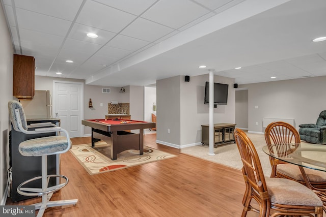 playroom featuring light wood-type flooring, visible vents, baseboards, pool table, and a paneled ceiling